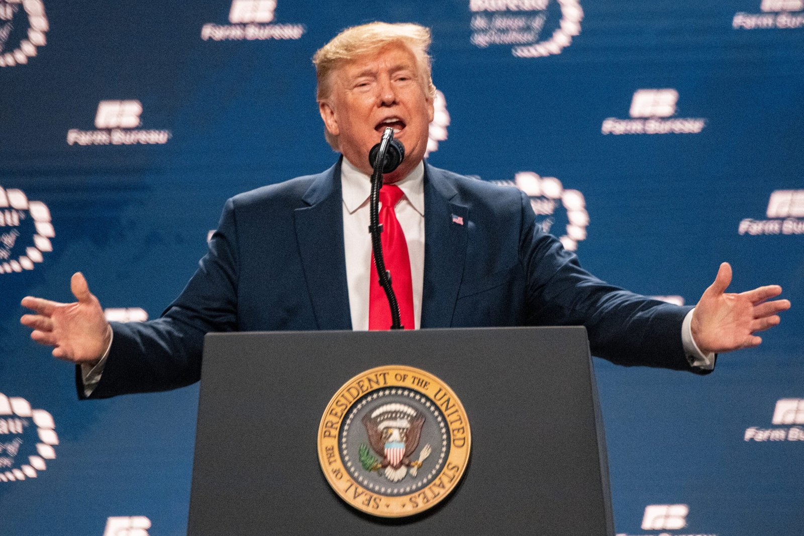 Donald Trump with a determined expression, discussing his request for extended pre-trial delays in the election subversion case.