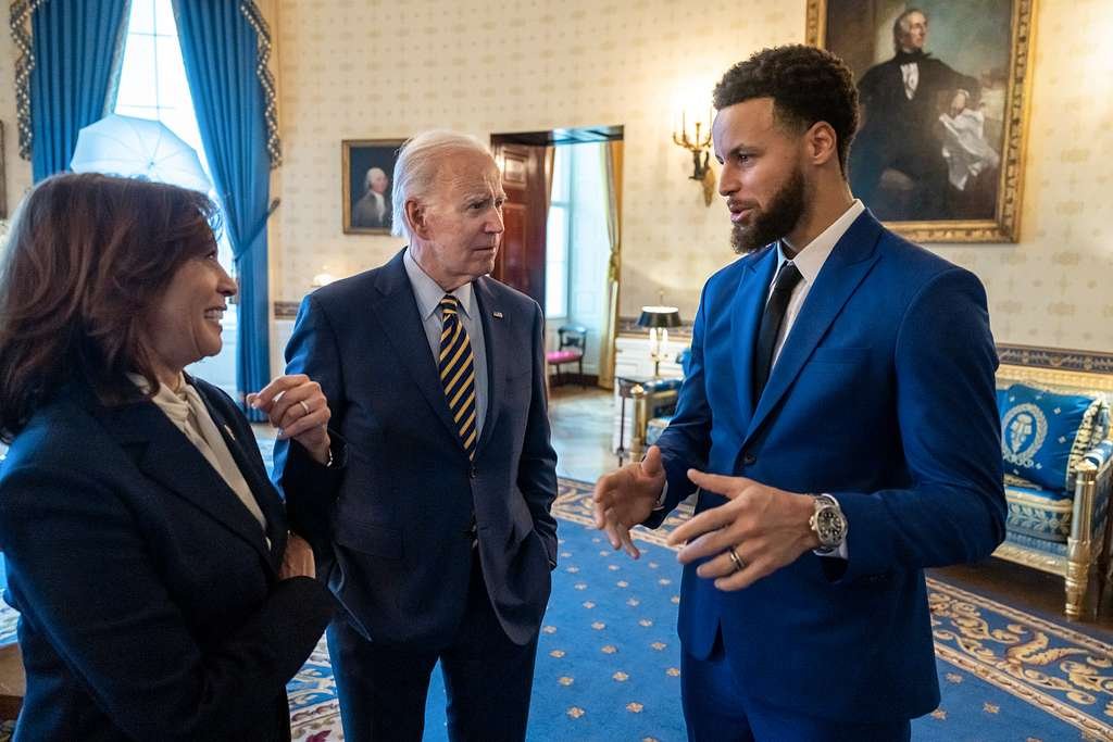 Steph Curry endorses Kamala Harris at the Democratic National Convention in Chicago, showing his support on stage.