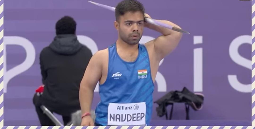 Navdeep Singh celebrating with his gold medal after setting the F41 javelin world record at the Paris 2024 Paralympics.